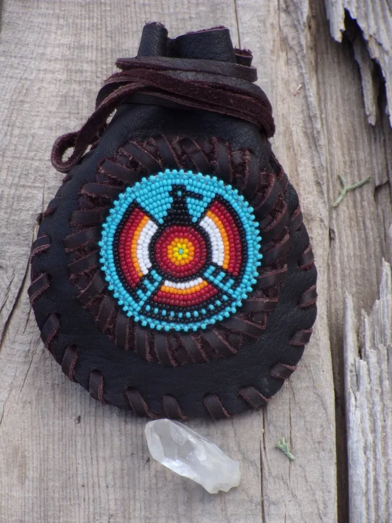 Amulet bag with beaded Thunderbird, necklace bag , leather medicine pouch